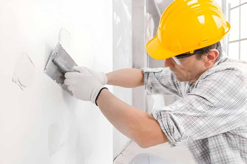 Stucco application worker